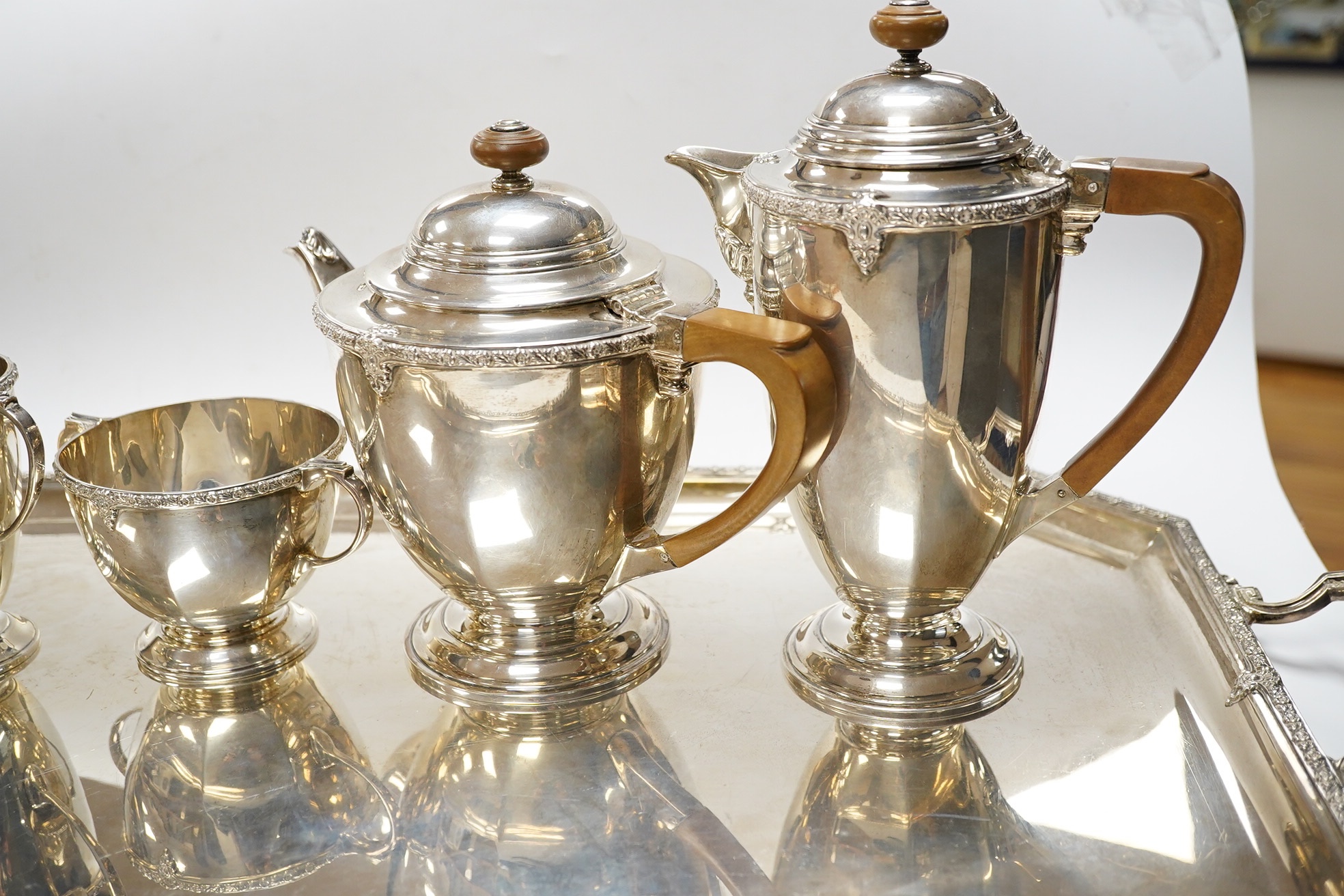 A George V silver five piece silver tea service including a two handled tea tray by Roberts & Belk, Sheffield, 1931/1934, tray 61.2cm over handles, gross weight 165.1oz. Condition - Fair to good